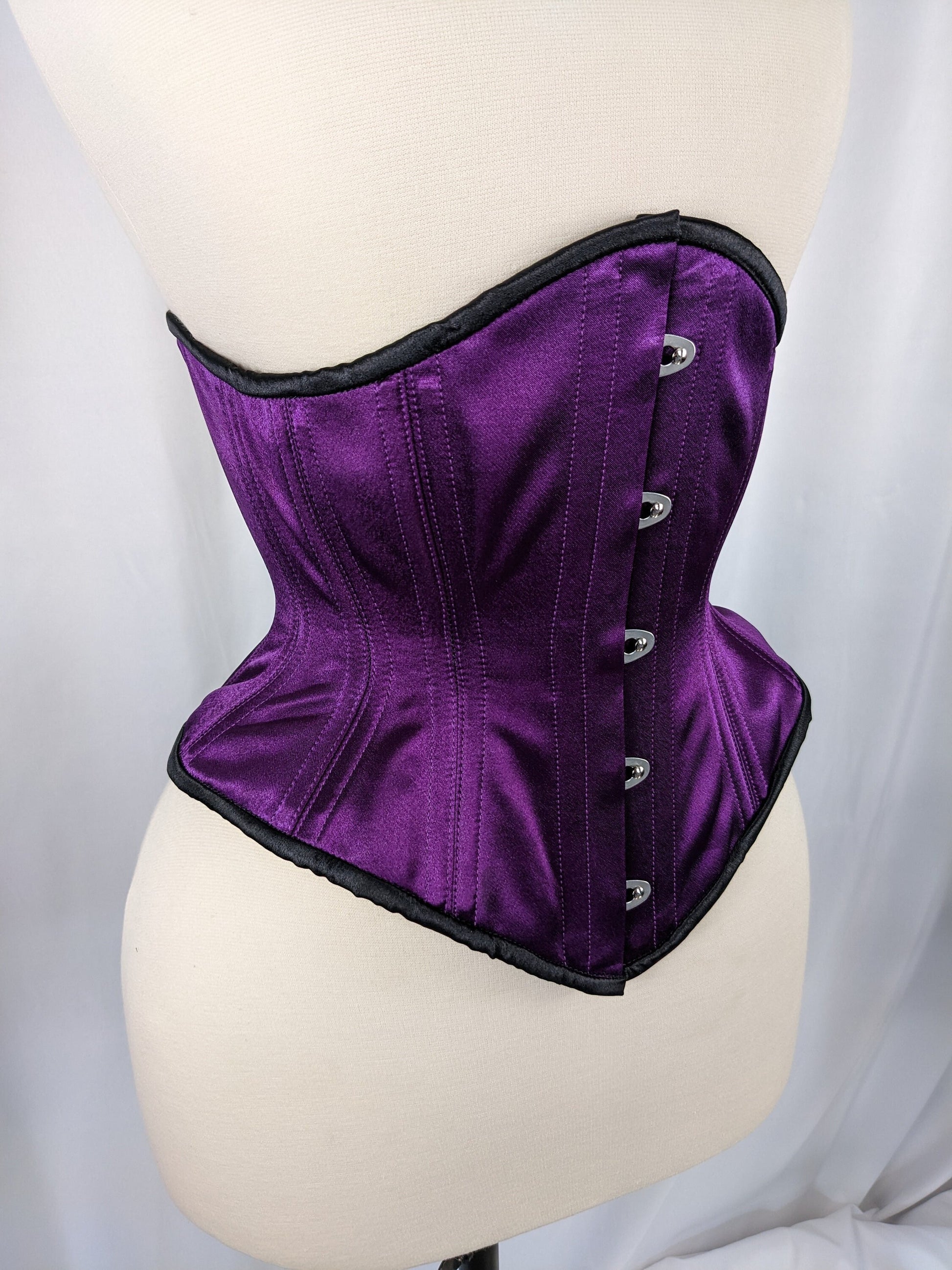purple and black midbust steel boned corset made by Battie…