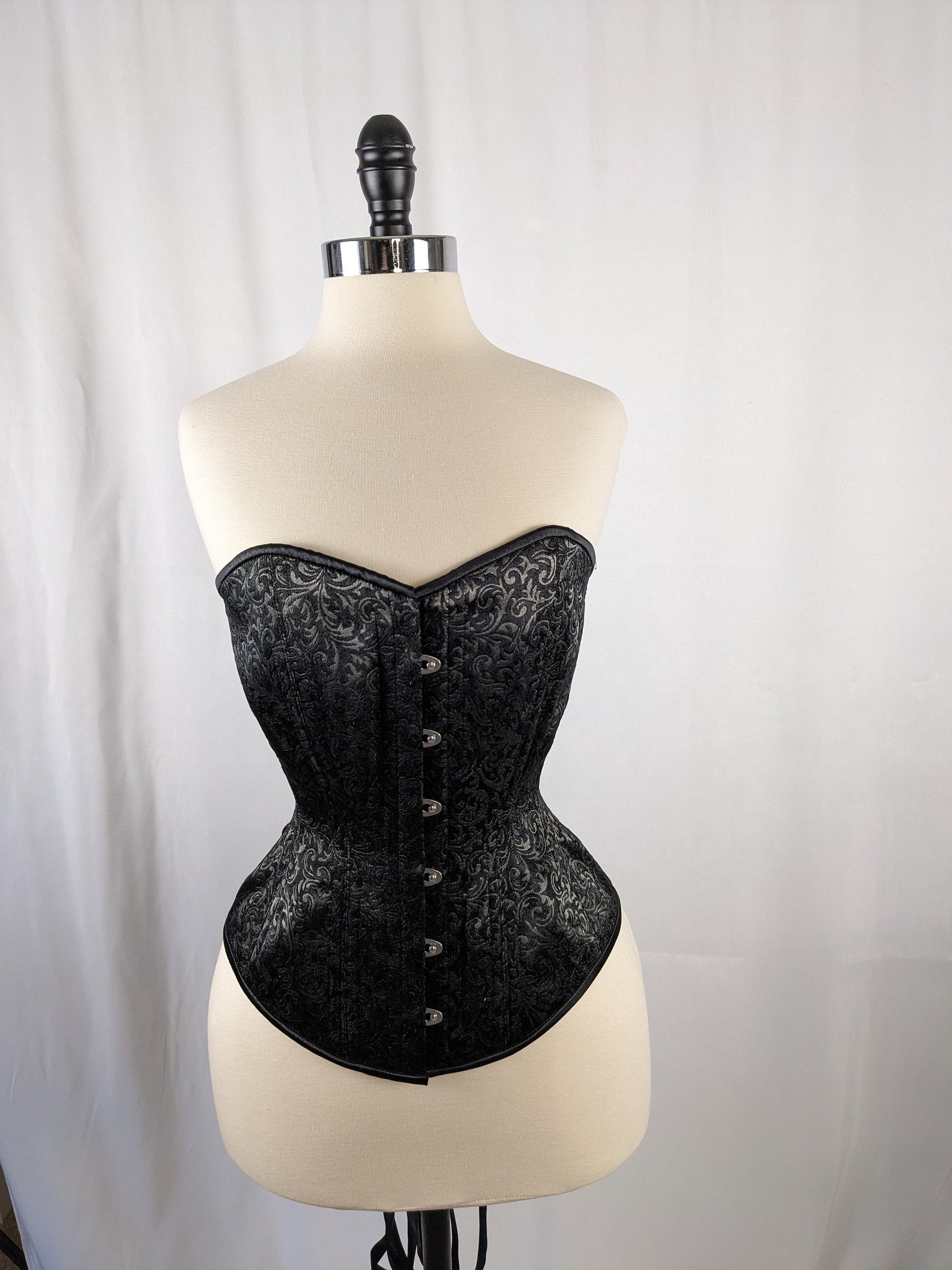 Black satin steel boned corset with front clasp closure